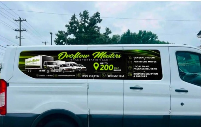Overflow Masters Transportation branded white cargo van with company logo, services and phone numbers